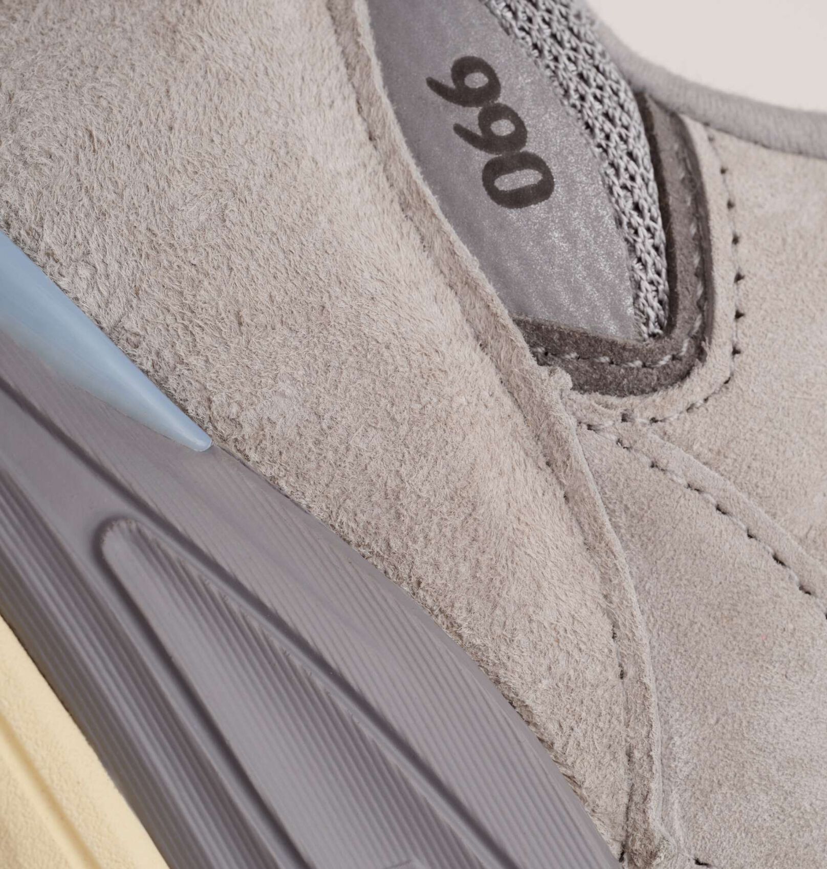A close up of the 990v7 sneaker showcasing the material and texture.